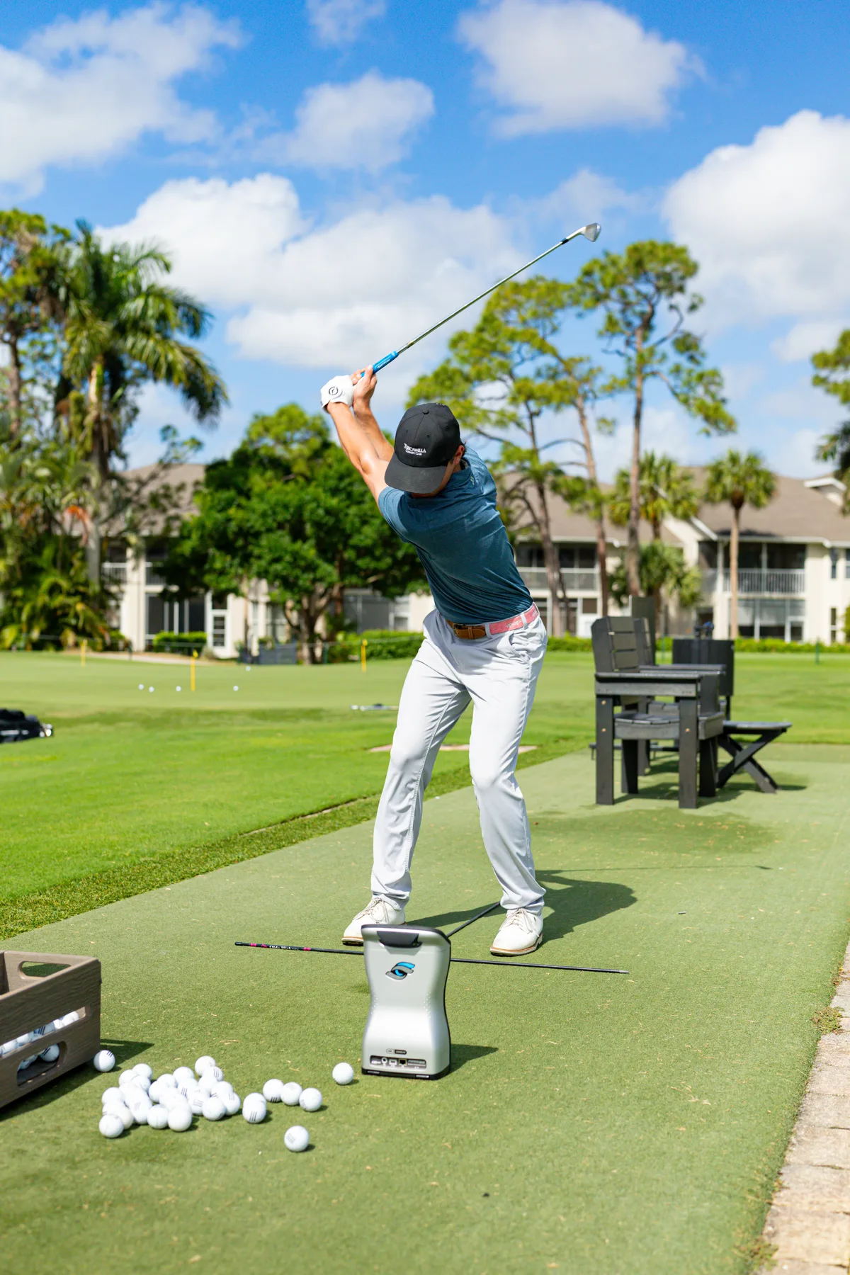 Ryan Hogan at the top of his swing on the range at Redline